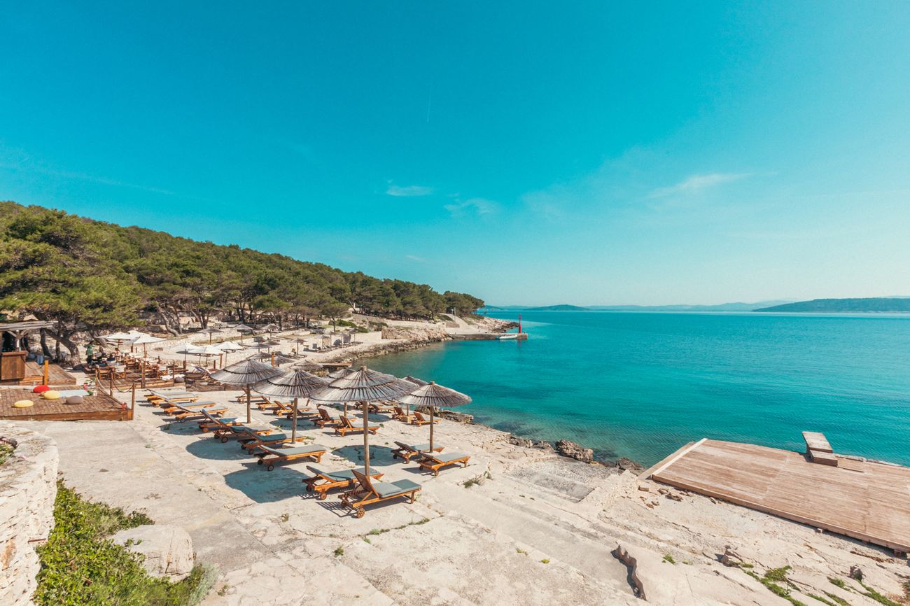 The beach club and the bay from above