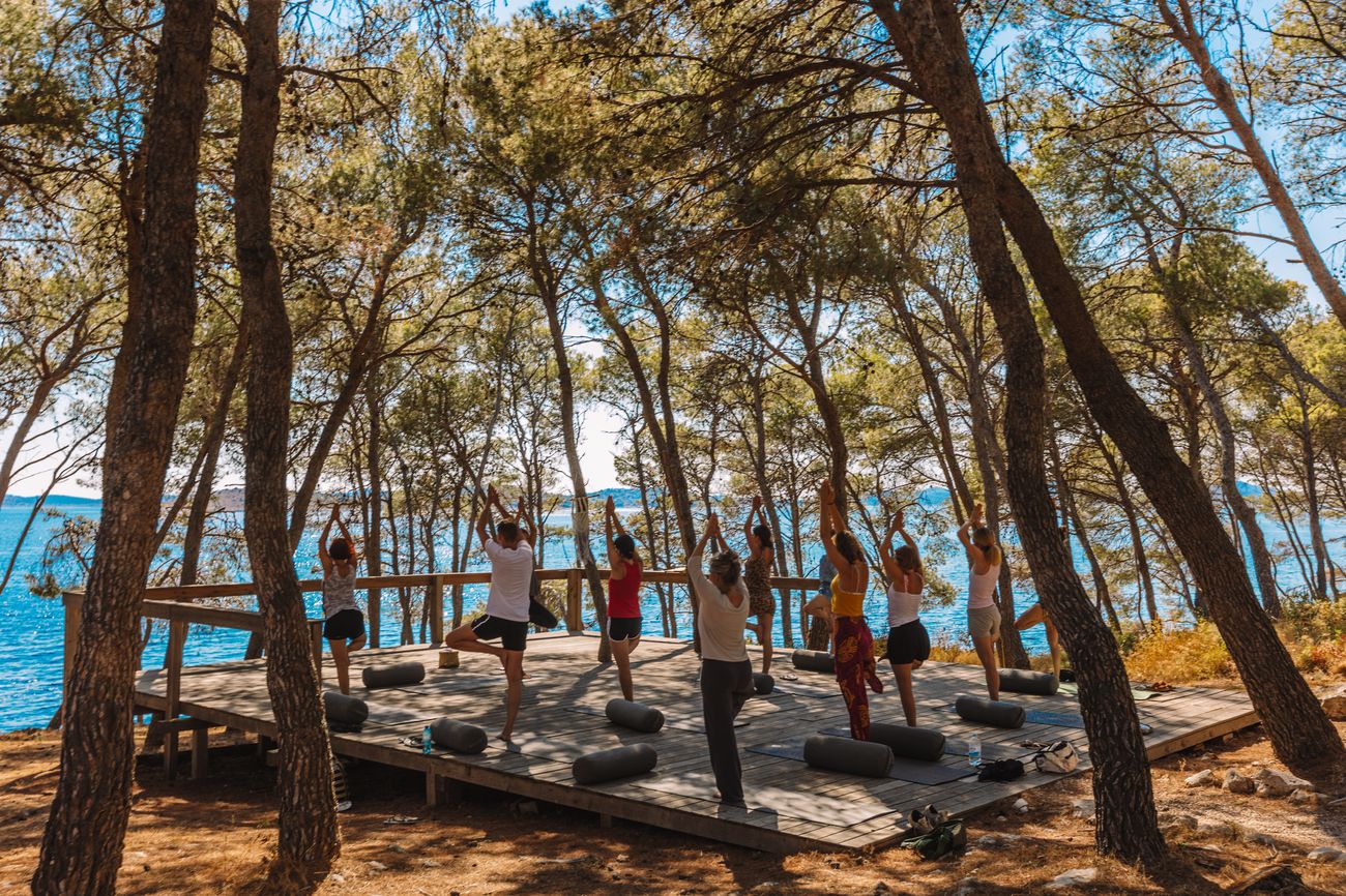 Morning yoga on the deck among the pines